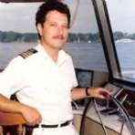 0-12 Captain Paul at the helm of 85' motor yacht